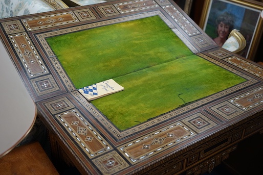 A 19th century Damascus mother of pearl, bone, and marquetry inlaid folding games table, with card, backgammon and chess surfaces, width 94cm, depth 47cm, height 85cm